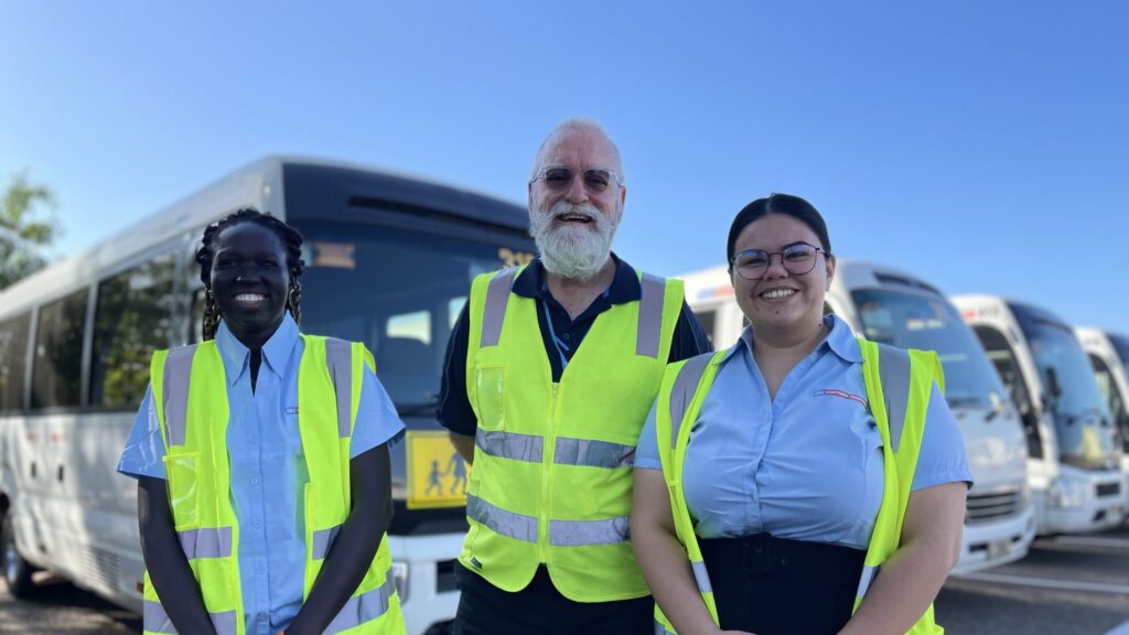 CDC staff standing in front of buses