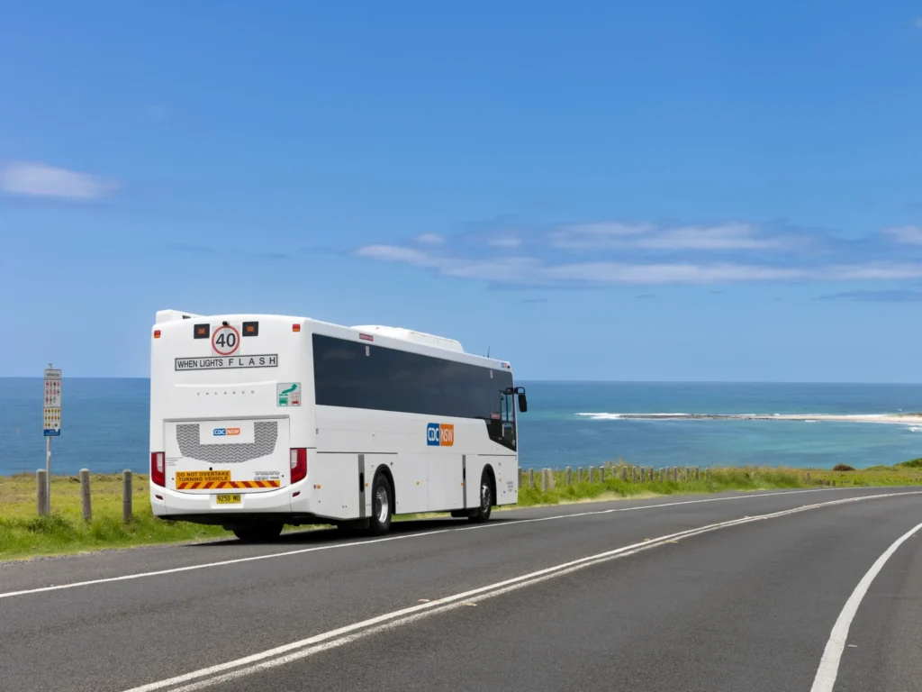 CDC NSW bus running on the beach